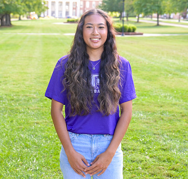 Brittany Phally posting on the Main Quid, looking at the camera.