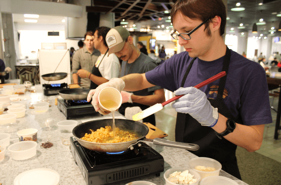 A student participating in Teaching Kitchen in the Caf. 