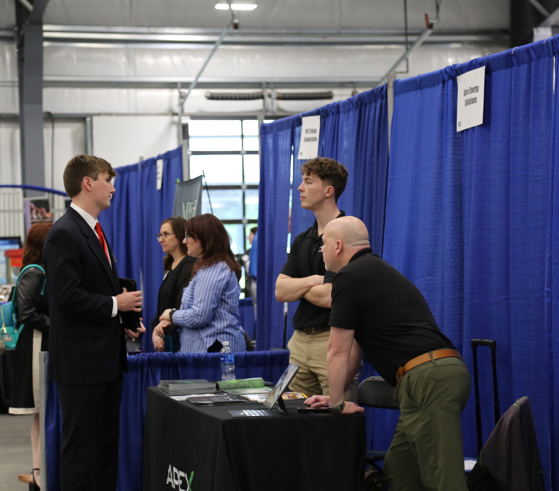 Student talking to employers at the Nashville Area Career Fair