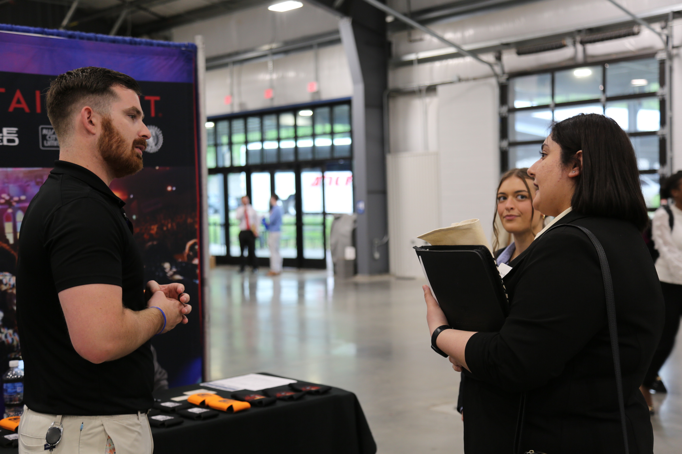 Students speaking to employers at the Nashville Area Career Fair