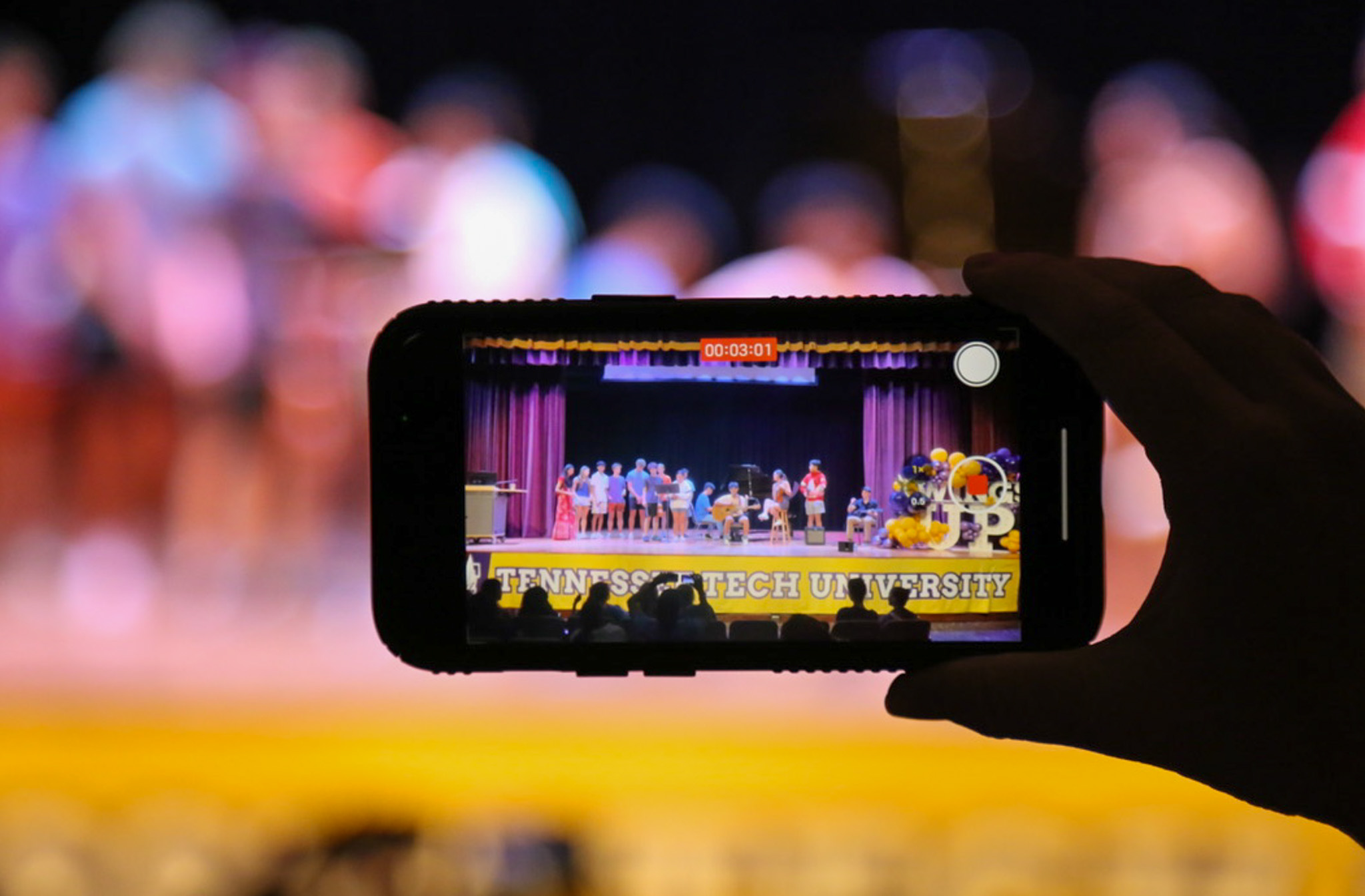 Phone taking video of talent show