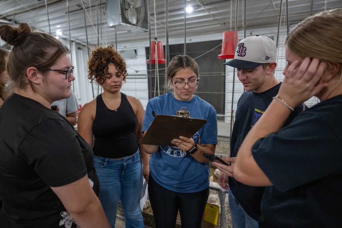 Poultry science students discuss observations and record data during a hands-on learning activity at the Tennessee Tech Poultry Science Research Center.