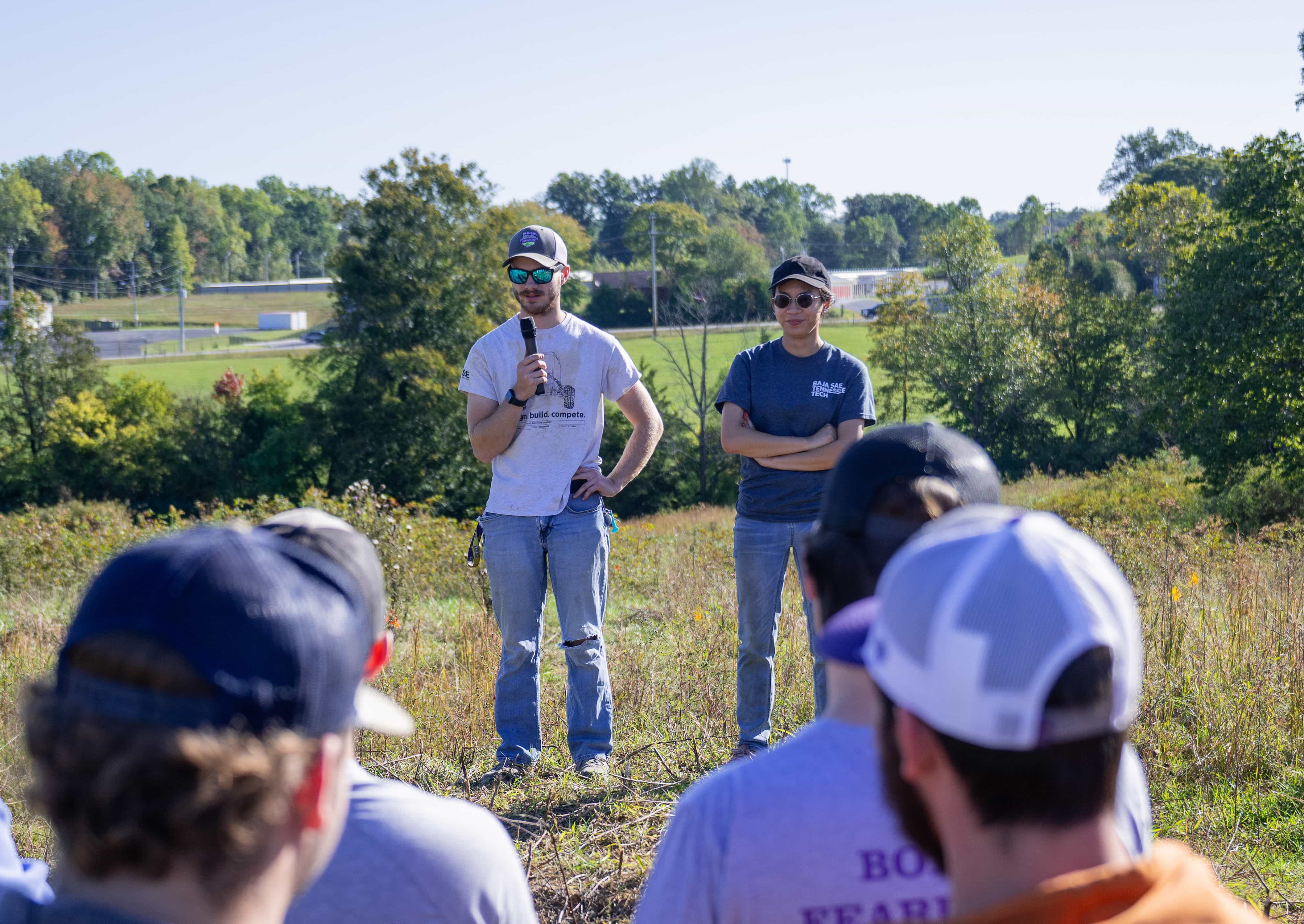 Agriculture students participate in an outdoor field lesson led by an instructor at the Tech Farm