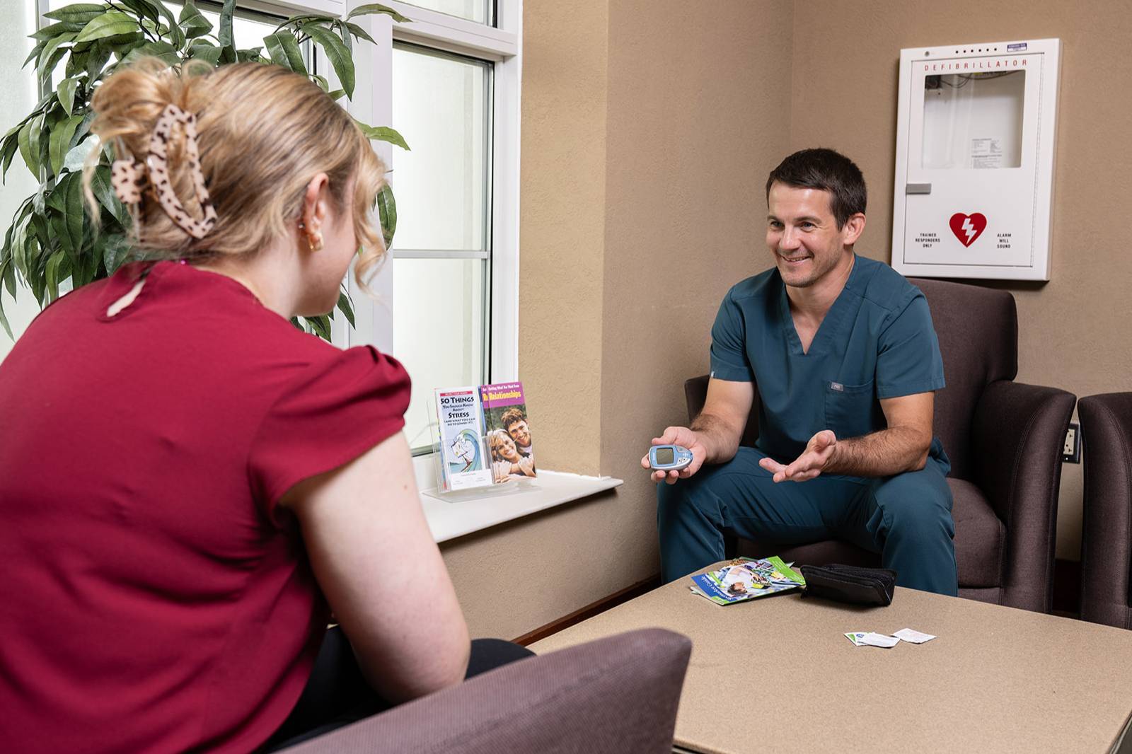 Community Health and Nutrition student speaking to a patient