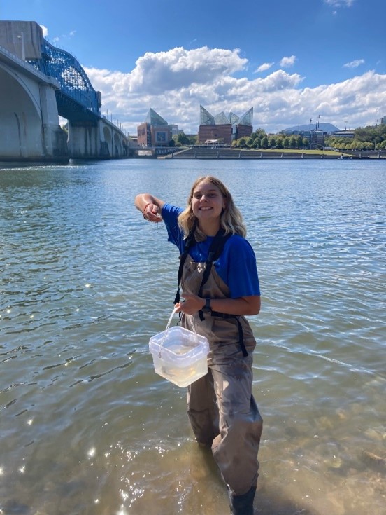 Avery Davis standing in water and smiling