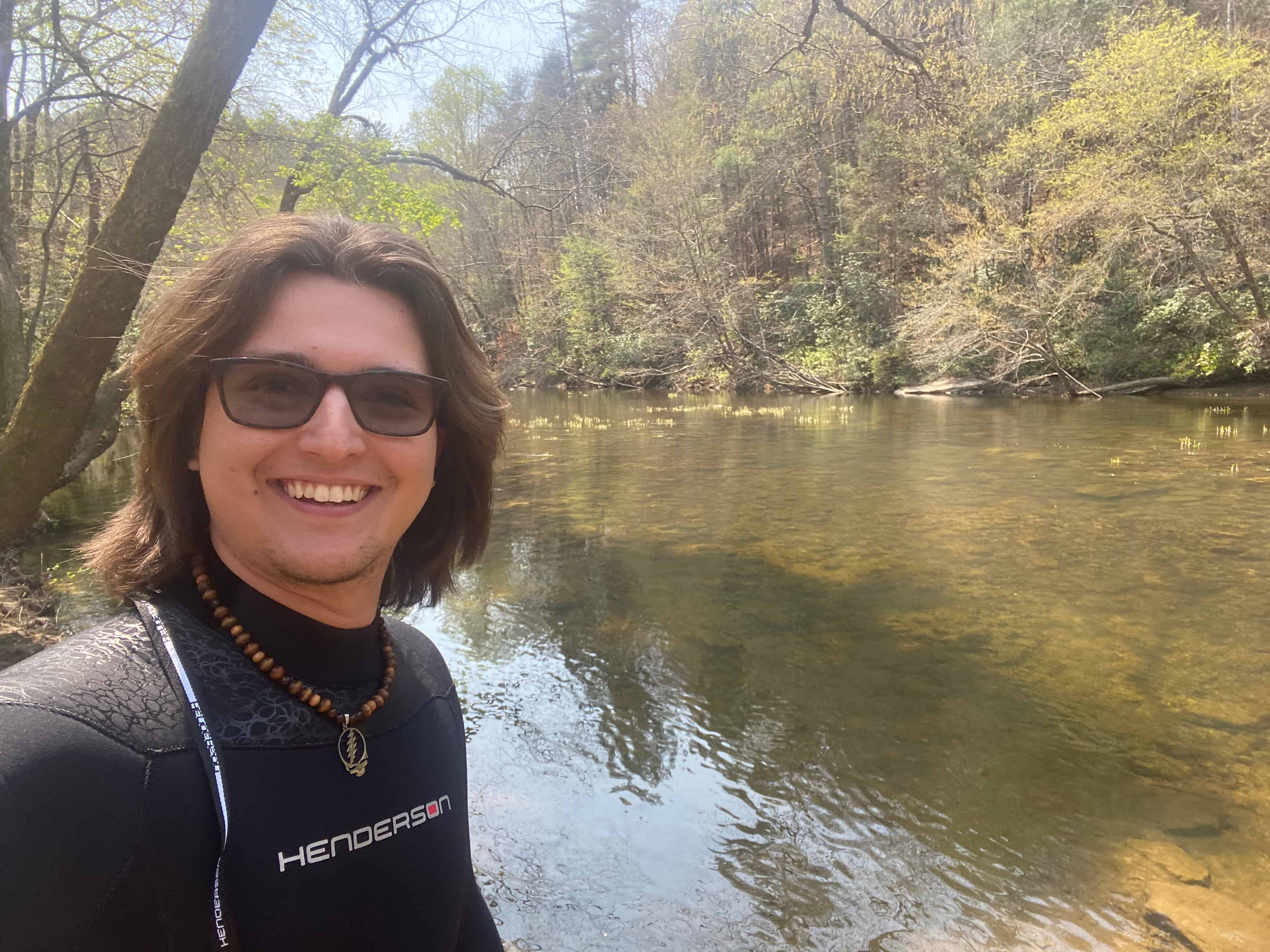 Noah Meyer standing in a creek