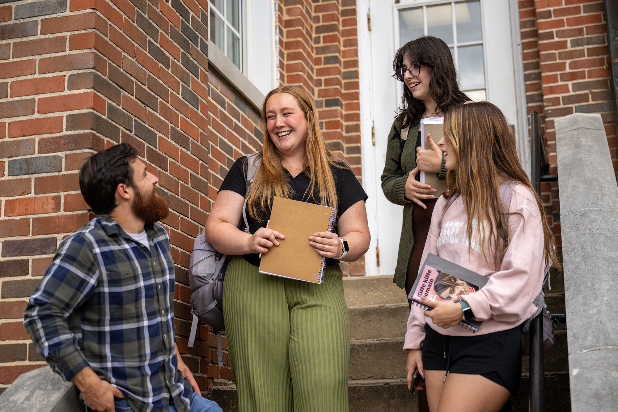 foreign language students talking in front of the building