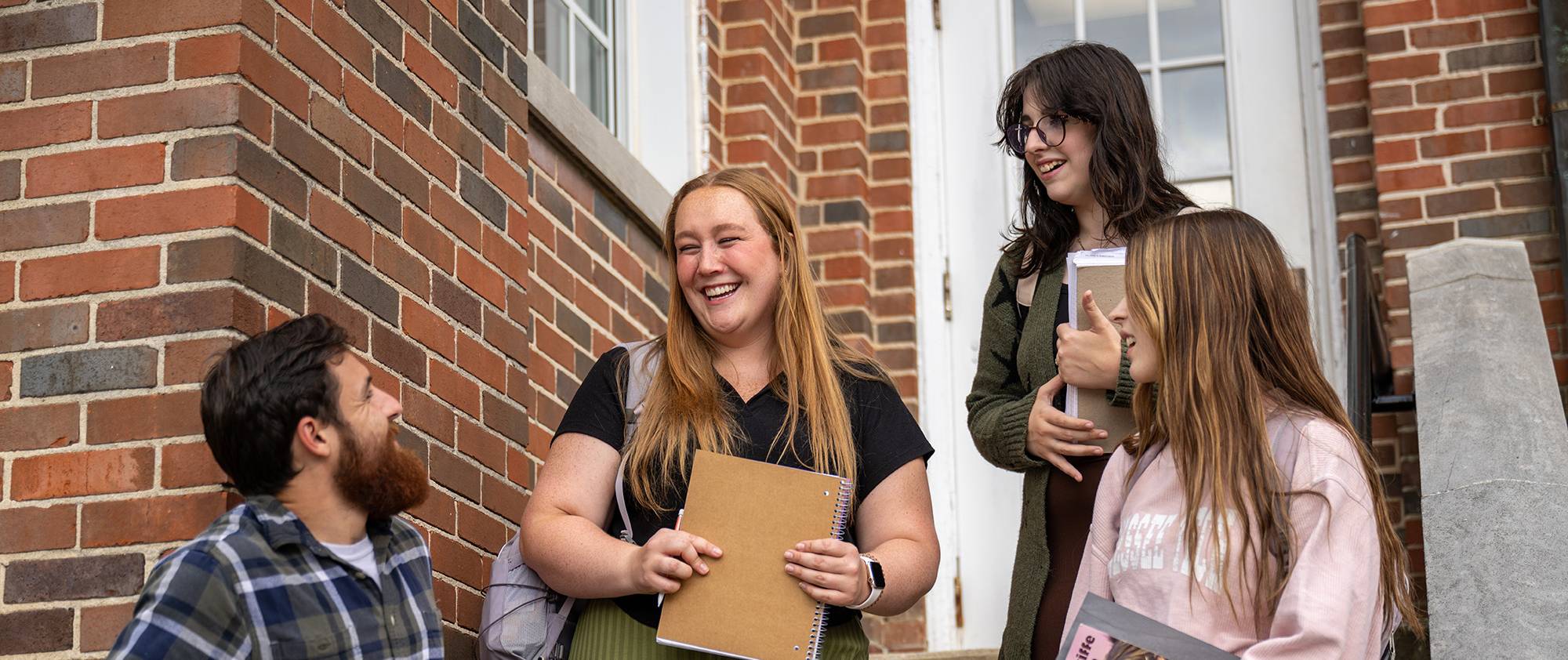 students talking in front of the foreign languages building