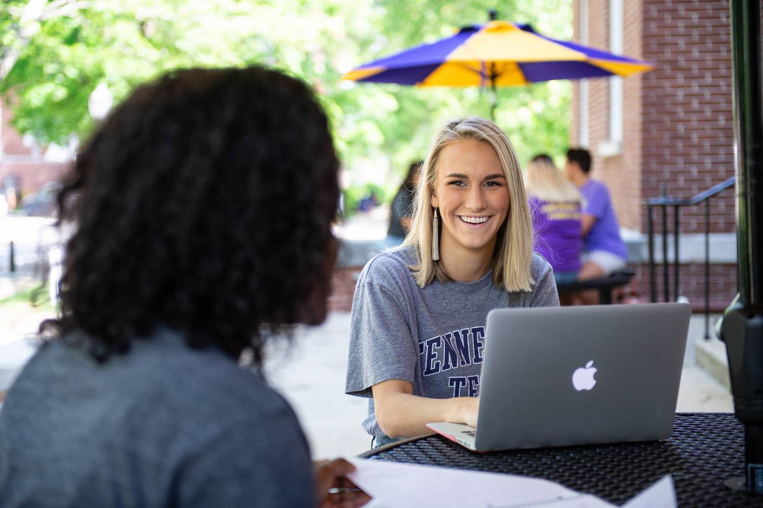 students sitting on Main Quad working 