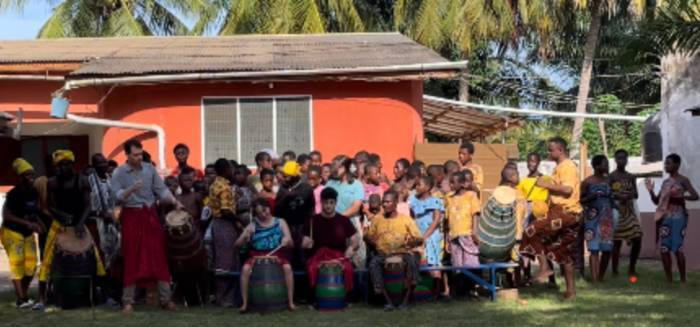 Group photo of drumming activity in Ghana.