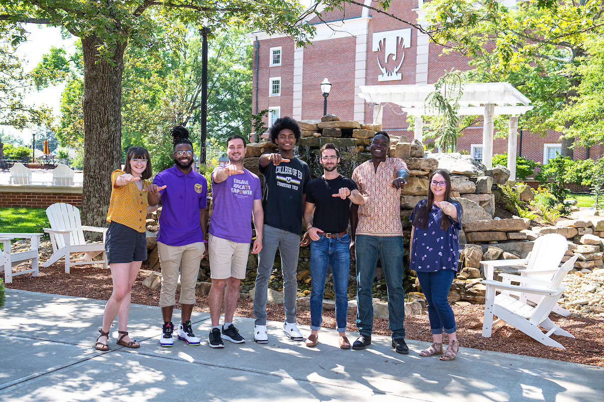 Students standing in front of Fearless Falls. 