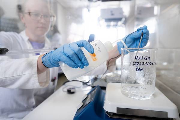Student in lab working with chemicals