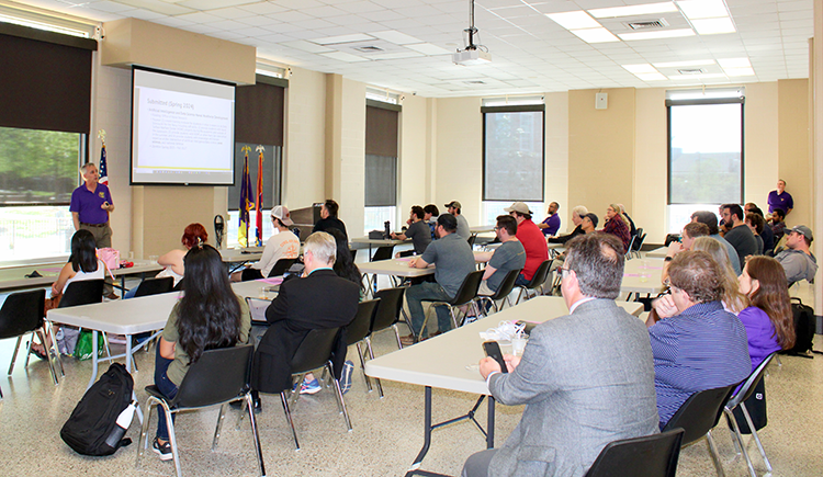 Tech's MInDS fuels AI Innovation and Partnerships People gather in classroom during AI event