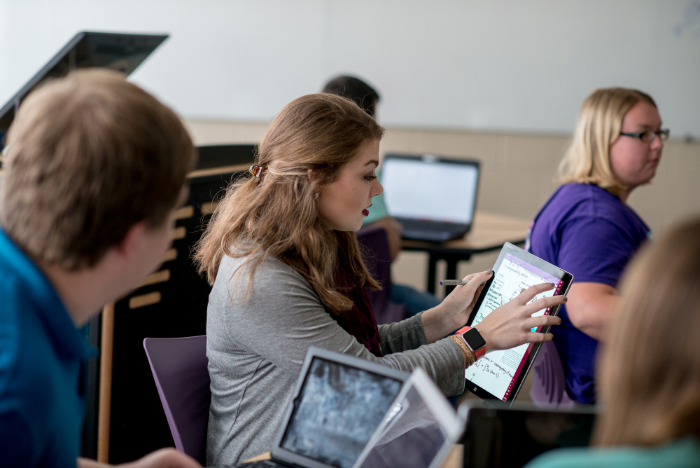 Students studying on tablets together