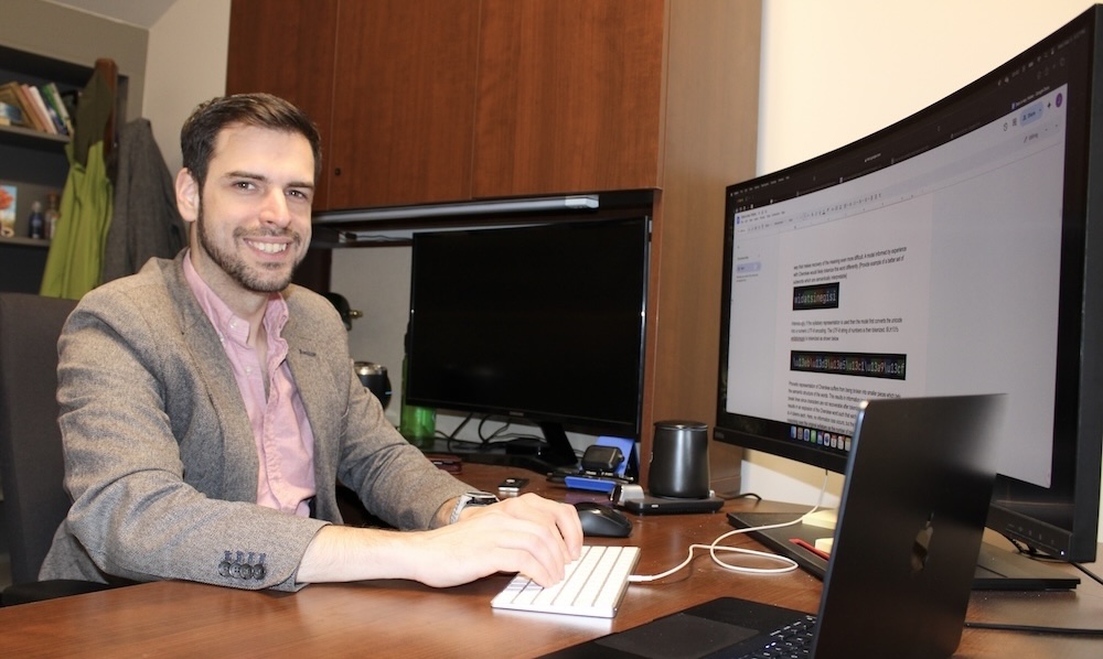 Jesse Roberts, Ph.D., sits at desk