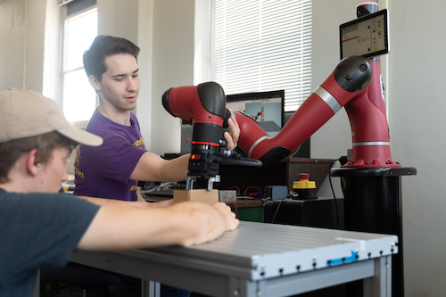 Engineering Technology students with collaborative robot Sawyer Engineering technology students learn collaborative robot