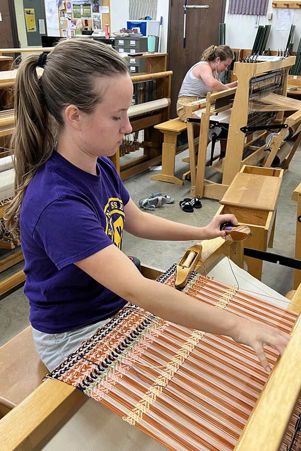 A student working in the Fibers Studio.