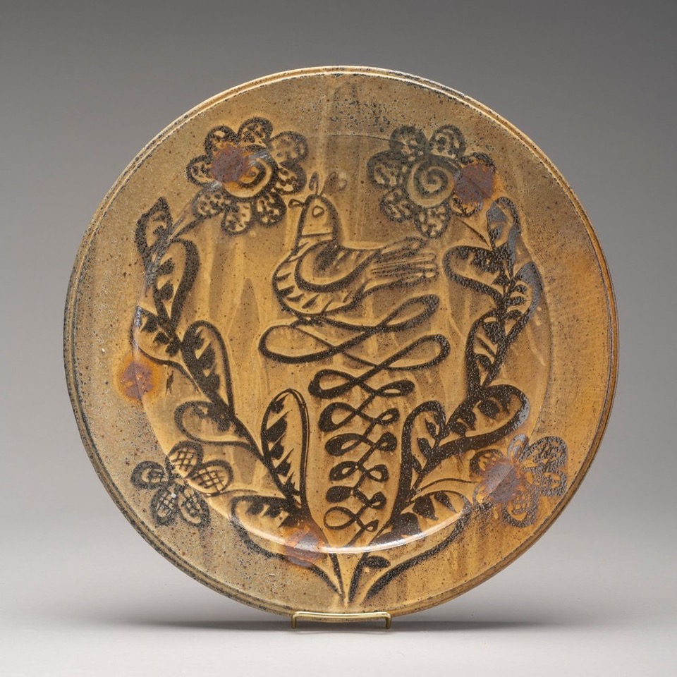 Andy foster work. clay plate with leaves painted on it