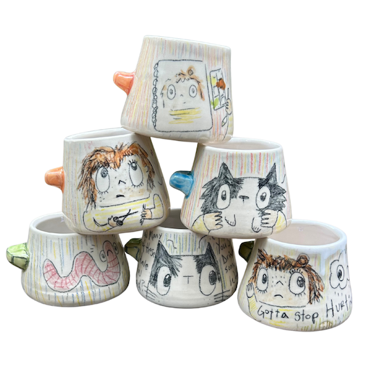 Several clay cups with drawings on the sides