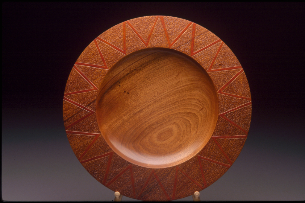 Wooden plate with engravings
