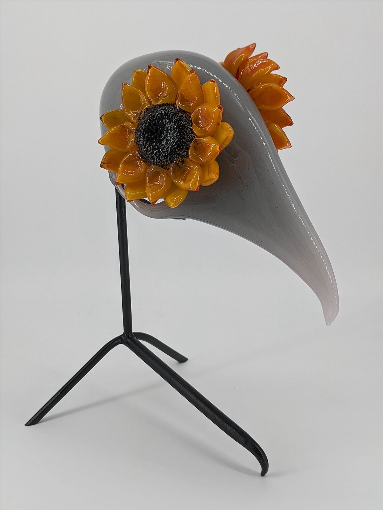 Glass animal skull with flowers as eyes