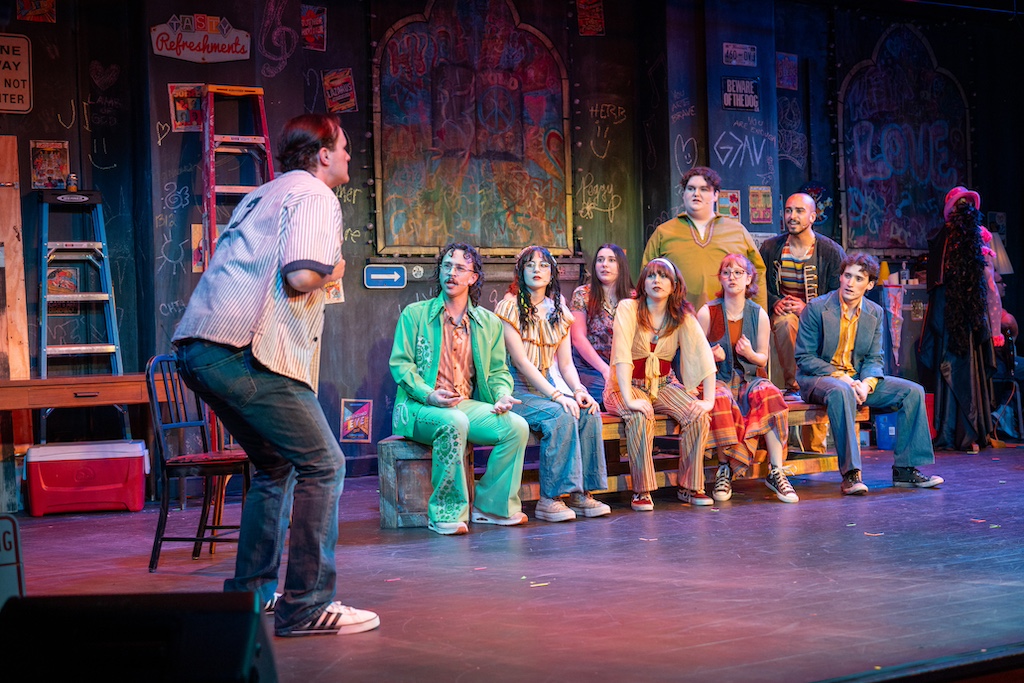 Godspell Godspell, Jesus preaching to the others in a squating pose