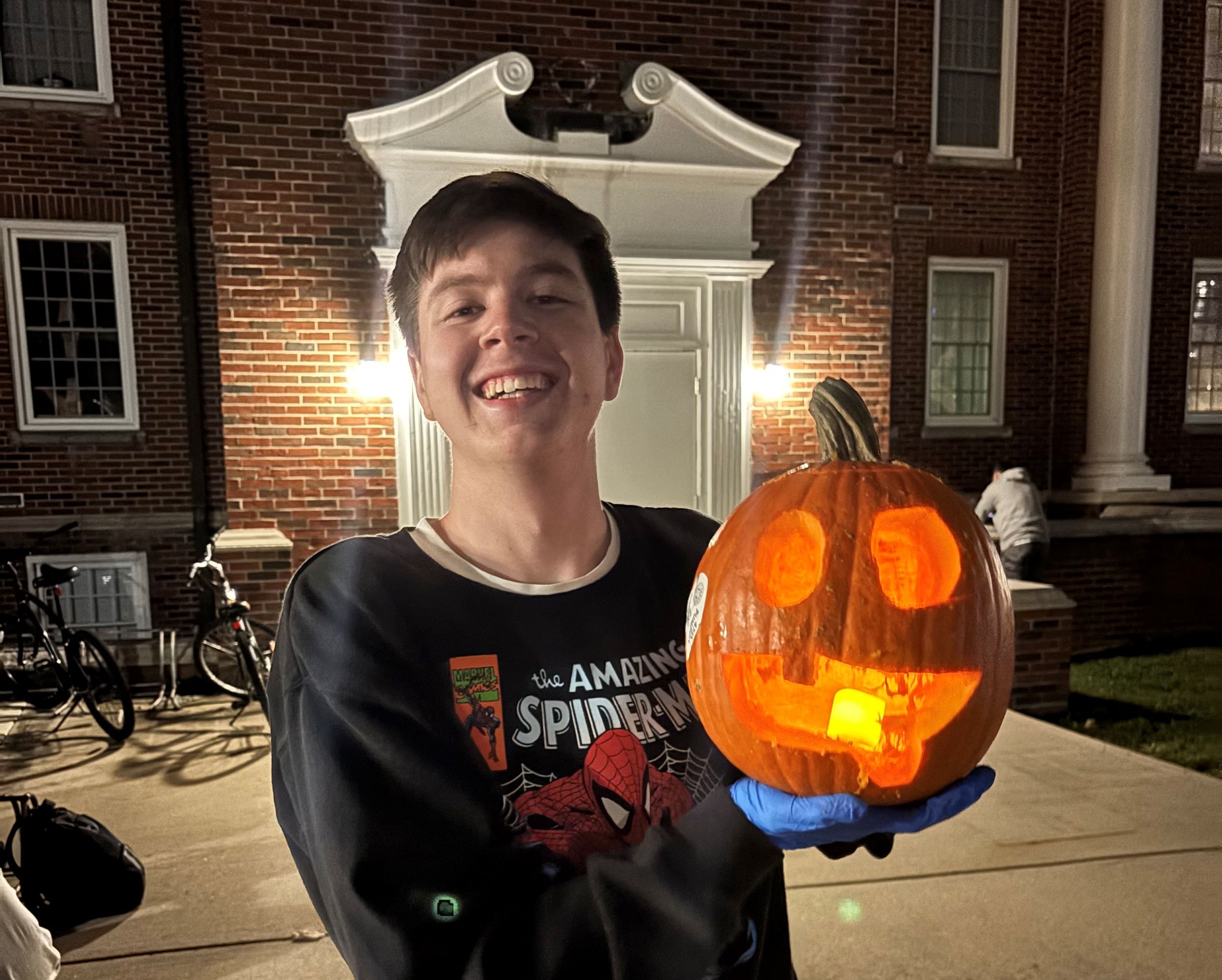 Student with a jack-o-lantern
