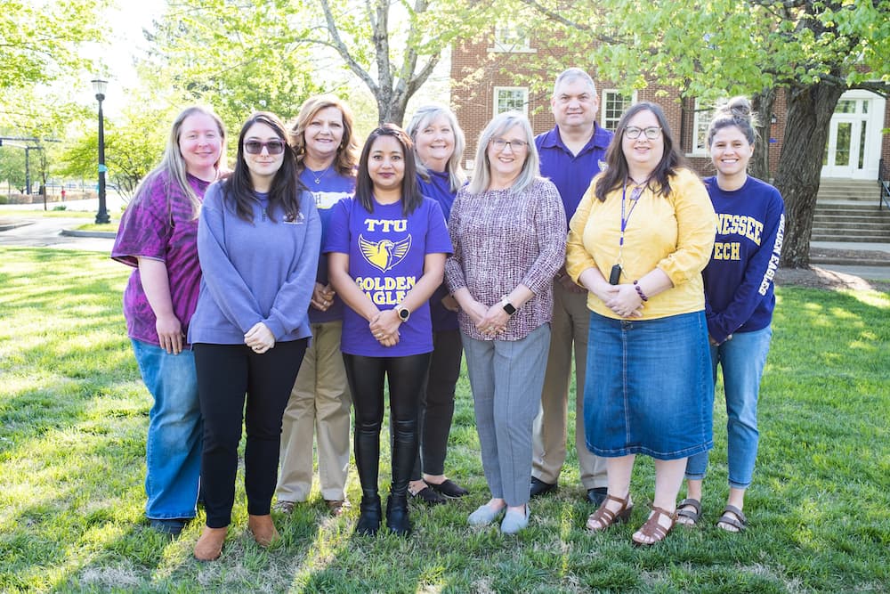 The Human Resources staff posing in front of Derryberry Hall