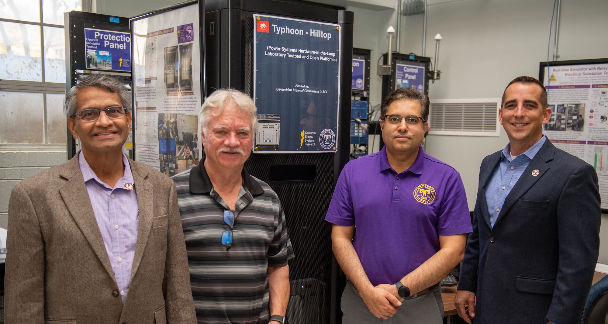 From left: Satish Mahajan, director of Tech’s Center for Energy Systems Research (CESR), Robert Craven, research and development engineer for CESR, Ali Arzani, research assistant professor for CESR, and Michael Aikens, director of Tech’s Center for Rural Innovation (TCRI) stand in front of the HILLTOP platform developed by Tennessee Tech and MIT that will be used in their Appalachian Regional Commission-funded electric grid research. 