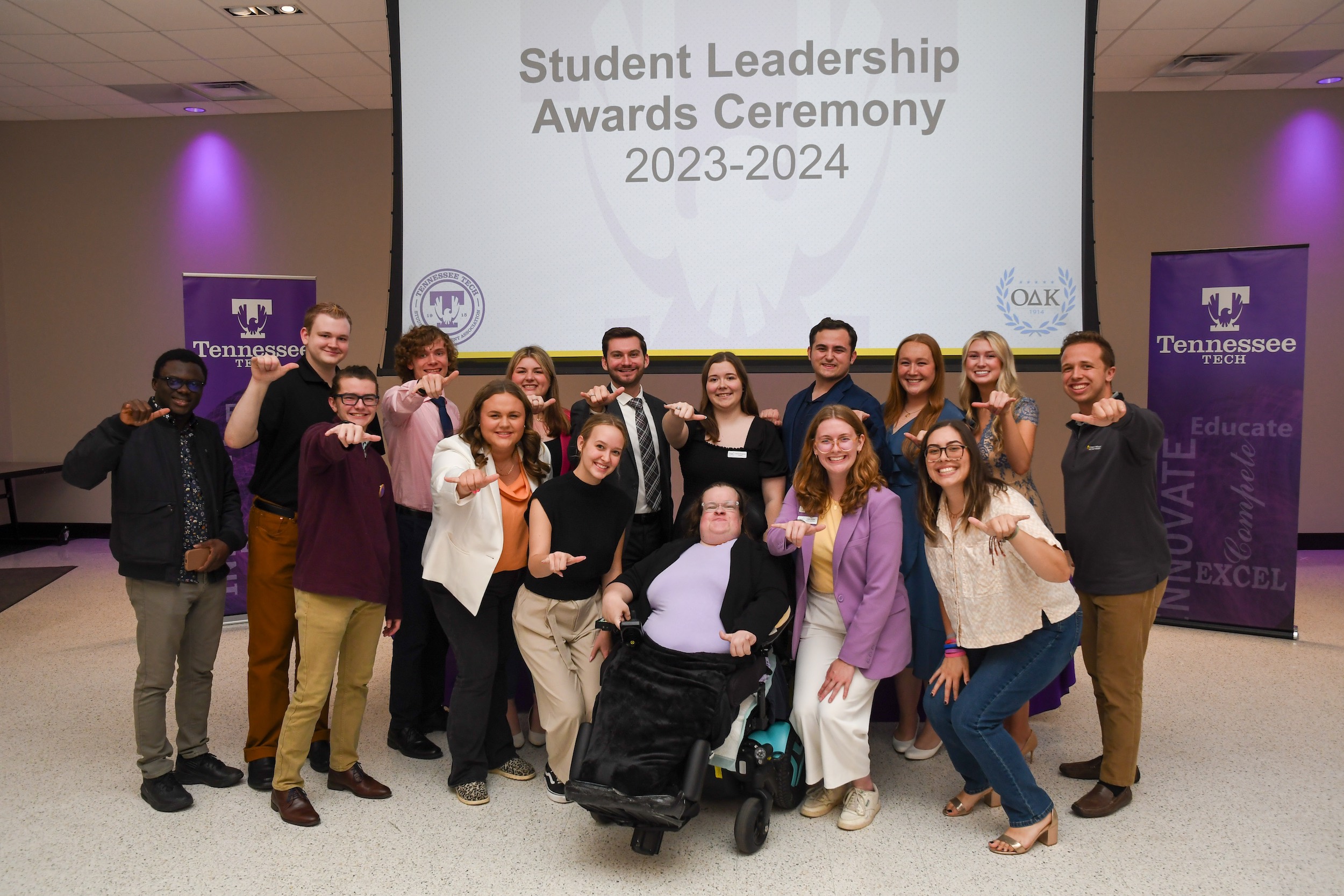 Members of Tennessee Tech's 2023 - 2024 Student Government Association give a "Wings Up" at Tech's 2024 Student Leadership Awards.