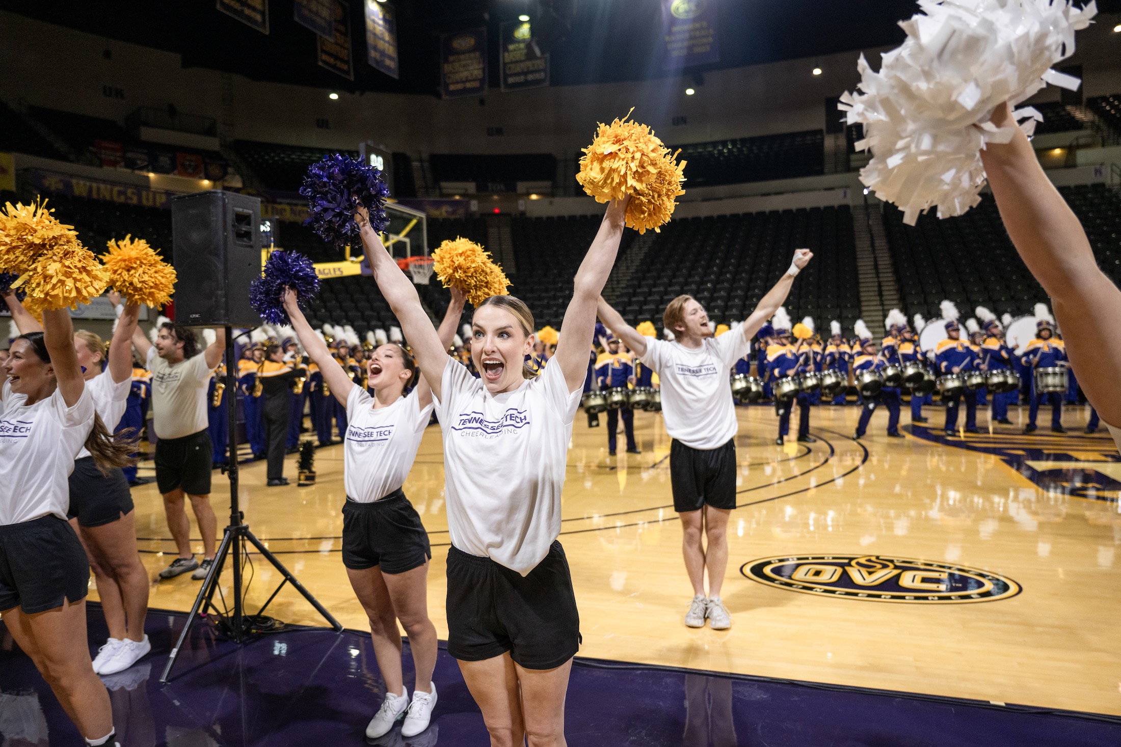 Members of the Tennessee Tech cheerleading squad perform for students before convocation begins.