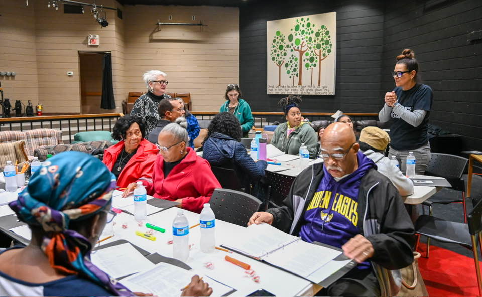 Cast members come together for a table read of “I Am My Ancestors’ Wildest Dream.” Cookeville Theatre Company president Kathleen Gilpatrick is pictured standing on the left, while director Lori Strode stands at right. Photo by Shannon Terry. 