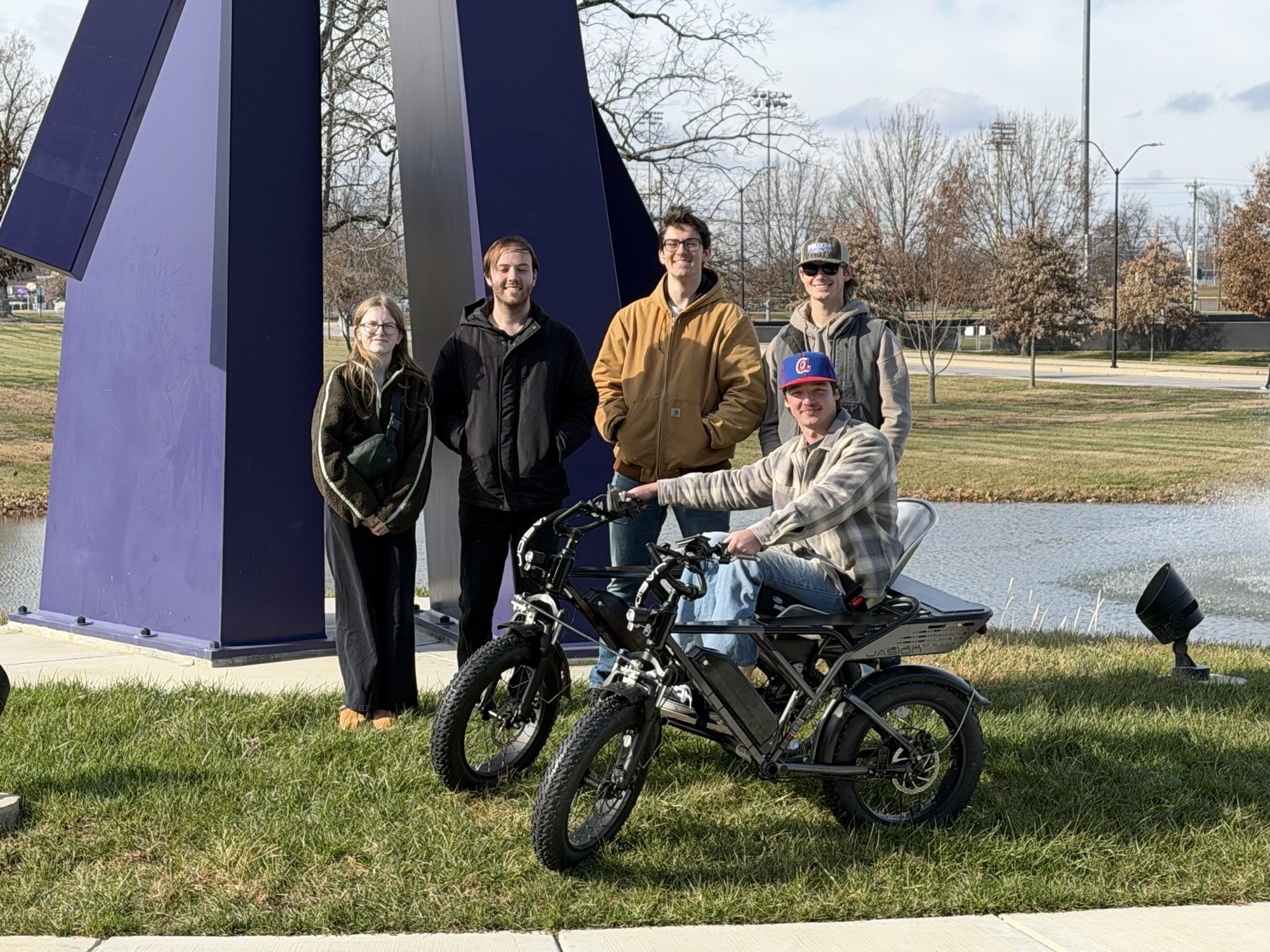 Nashville State Community College student Michael Vhan McGuire takes a ride in his new all-terrain wheelchair as the Tennessee Tech University engineering team that designed and built it looks on. From left, they are Christa Irby, Bradon Hopper, John Avery and Luke White; not pictured is Ashton Greenwood.