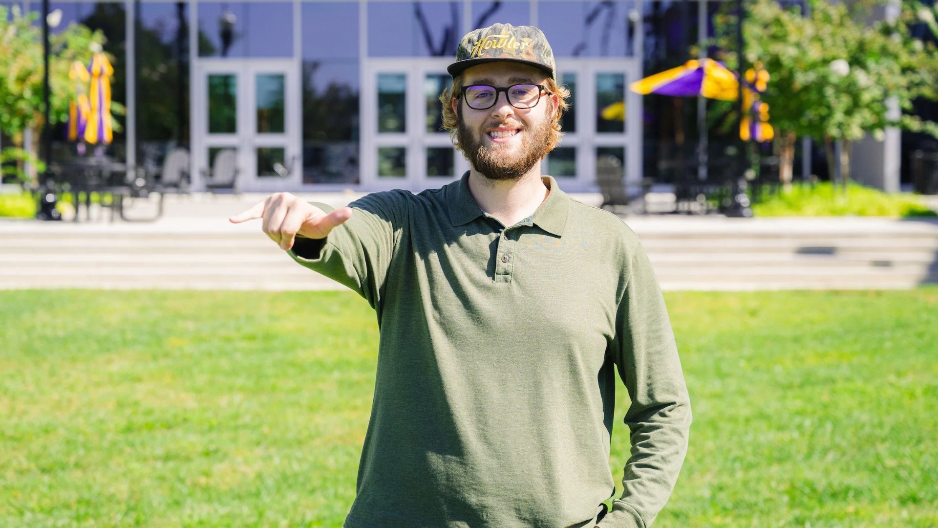 John Williamson John Williamson wears is pictured outdoors giving a Wings Up signal
