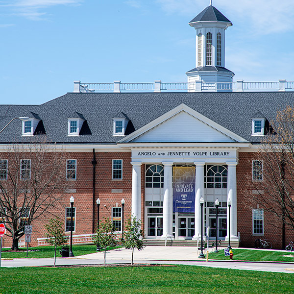 Front view of the Volpe Library during a sunny day.