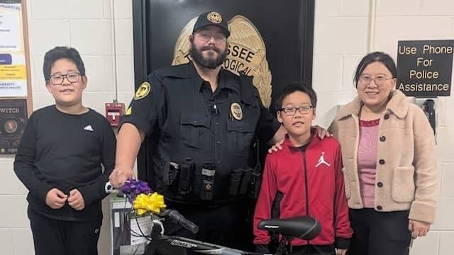 University Police donating bike to a local family