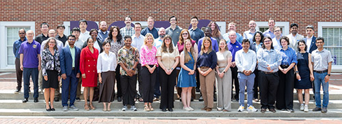 Pictured are the new faculty with Provost Latour on Centennial Plaza next to Derryberry Hall.