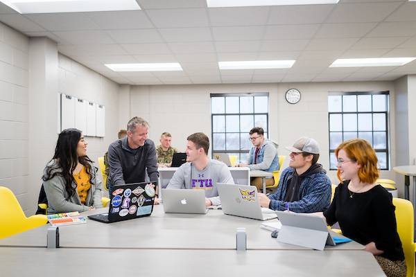 Engineering professor Robby Sanders with students