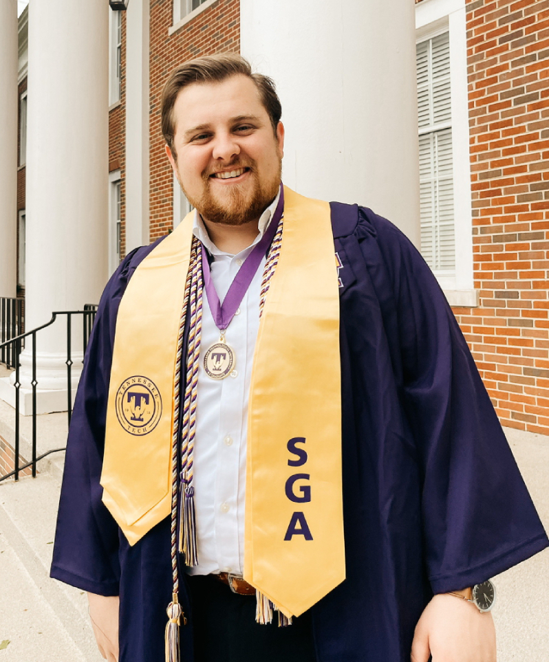 Aaron Thomas Lay in his TN Tech graduation gown.