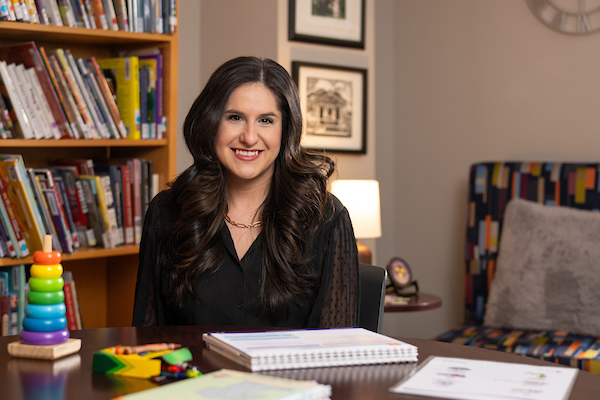 Dinorah Salinas smiling in her office.