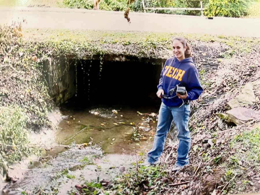 Carbajo, dressed in a Tech sweatshirt, stands by a waterway.