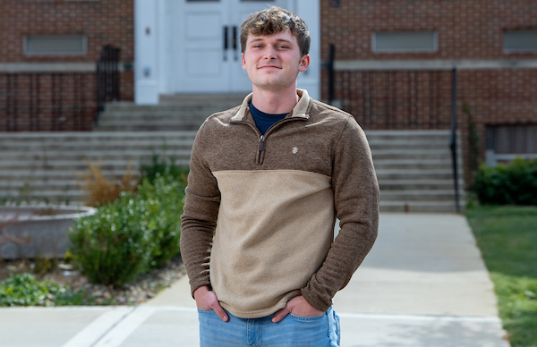 Jacob McMurray in front of Prescott Hall.