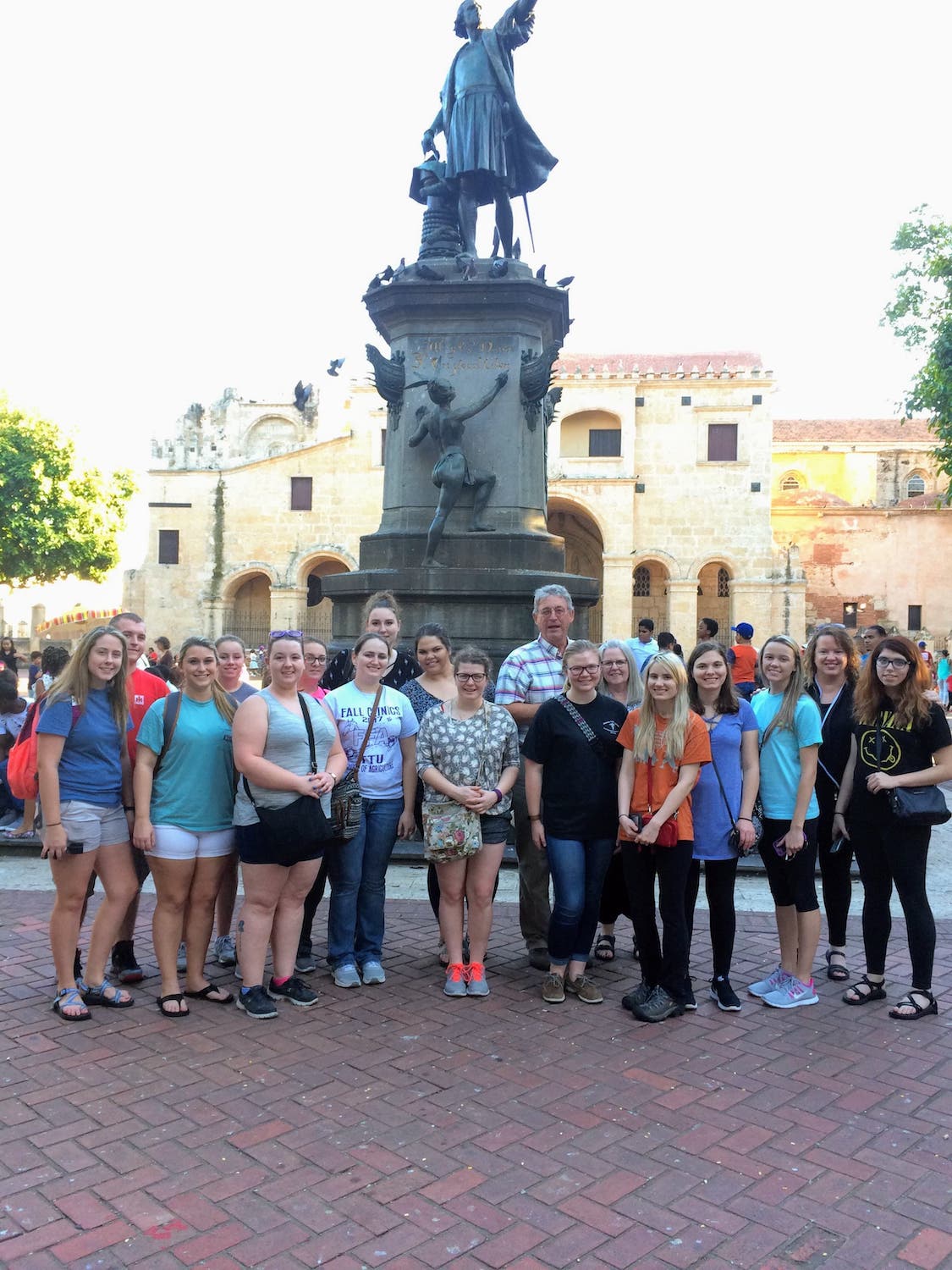 Group in front of statue.