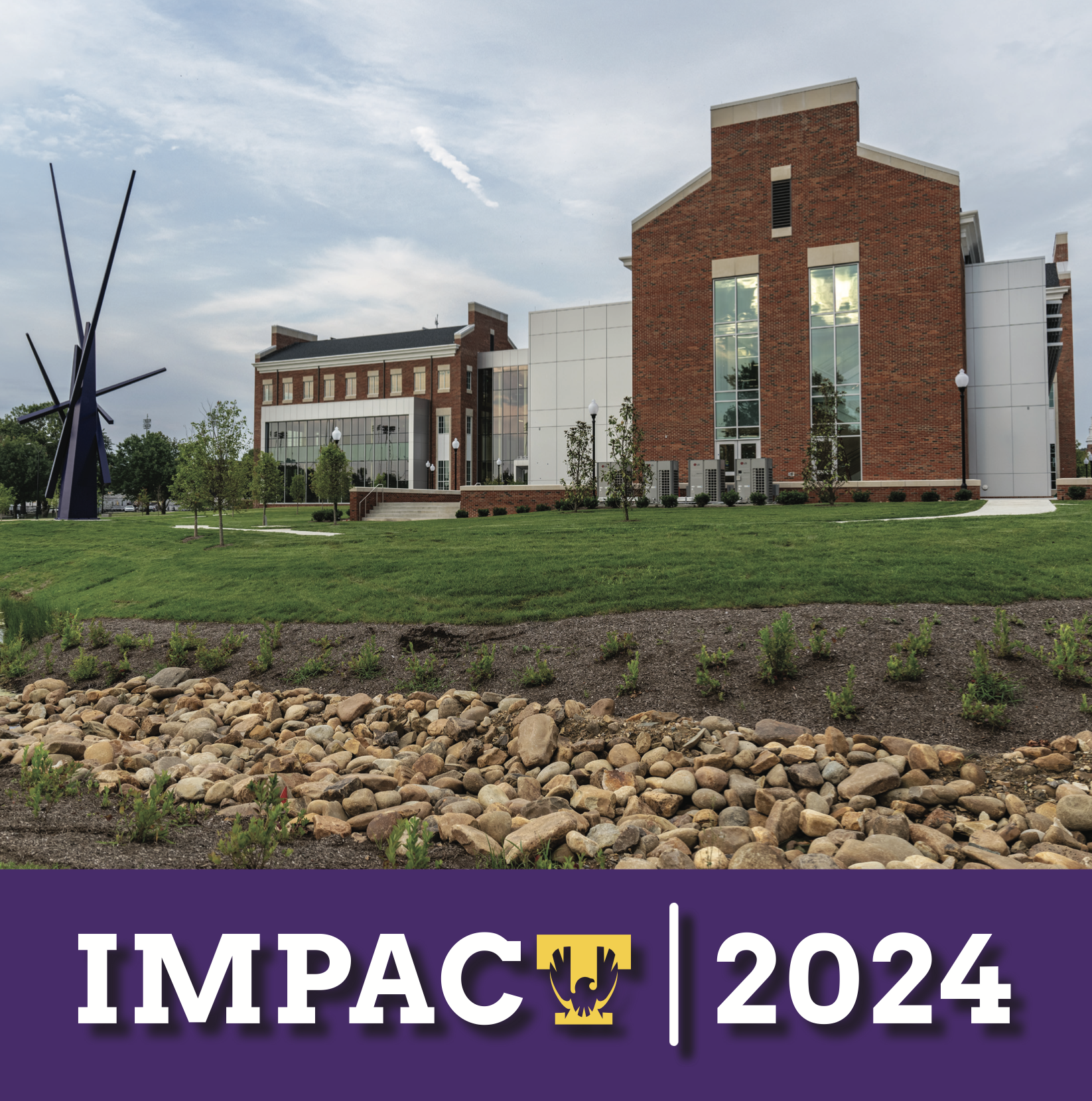 The cover of Impact - two students in a Human Ecology design lab