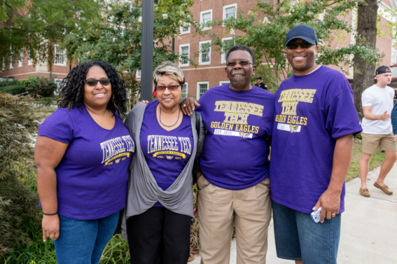 a group of four people wearing Tennessee Tech t-shirts.