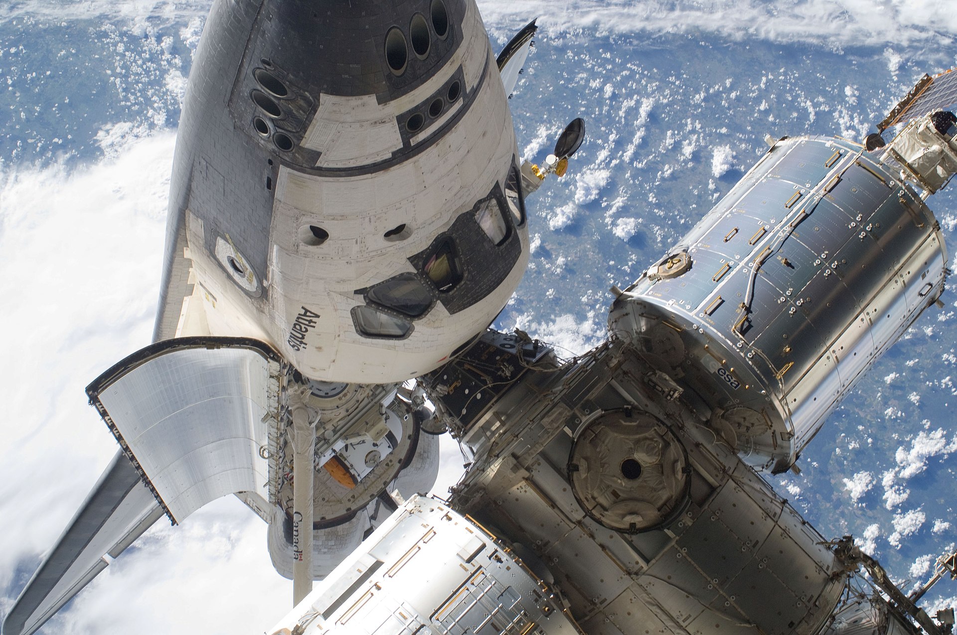 A space shuttle docked with the space station
