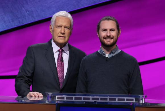 Jeopardy! host Alex Trebek poses with Sam Matson on the gameshow set