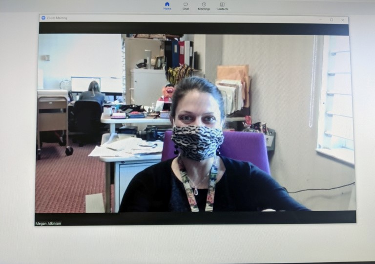University Archivist Megan Atkinson in "the most 2020 photograph" she could take: a selfie, with a mask, on a Zoom meeting. The only thing missing is her cat, Marvin, who attended meetings and assisted with archive projects while Megan worked from home.